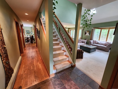 From the Foyer with living Room and Dining Room on the right, hallway to first floor bedroom, full bath, Laundry and then the Kitchen off the back of the house.