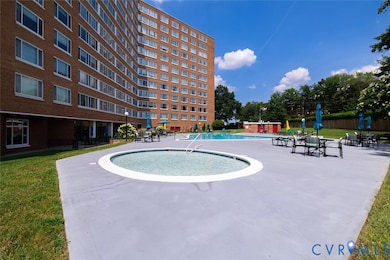 Community pool with a patio area