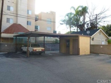 Parking area, behind units.  This small 'building' is where the washer and dryer are for the units.  Owner owns the washer & dryer, for all tenants to use.  It is the pay per use type.