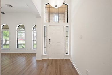 Entrance foyer featuring Vinyl plank floors and ba