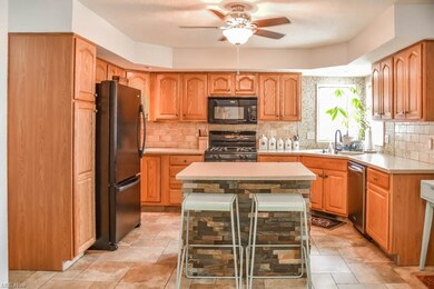 The kitchen has a pantry and solid surface counter