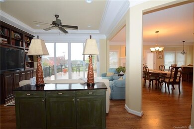Great room open to kitchen overlooks spacious back