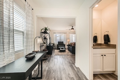 Corridor featuring wood finished floors