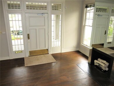 Entry Foyer with an old gas log fireplace that has