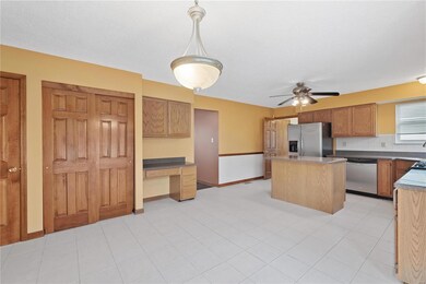 Kitchen has a built in planning desk and pantry