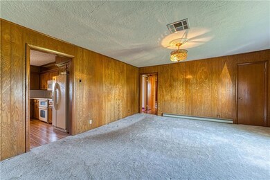 View down the hall to beds/view into kitchen