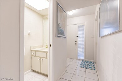 Bathroom featuring tile patterned flooring and van
