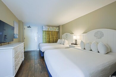 Bedroom featuring dark wood-style floors