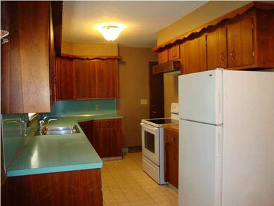 Kitchen has original custom cabinets and appliance