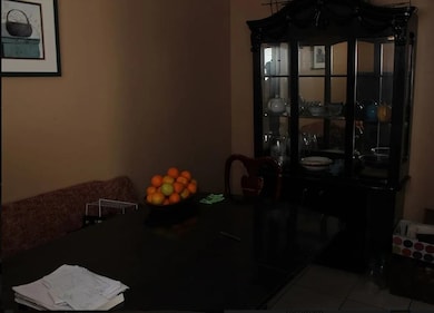 Dining area with light tile patterned floors