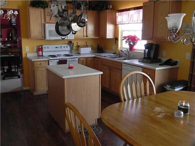 Kitchen The cozy kitchen with light wood cabinetry