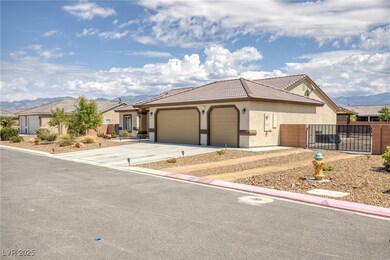 Ranch-style house with stucco siding, a garage, co