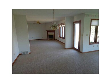. Looking into large living room. New carpet