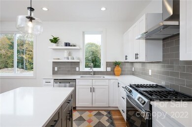 Mix of Floating Display Shelves, Shaker Cabinets and Soft-Close Drawers