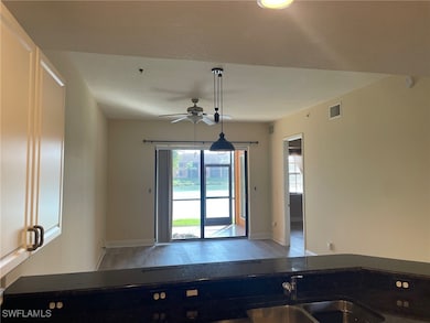 Kitchen with baseboards, visible vents, a ceiling