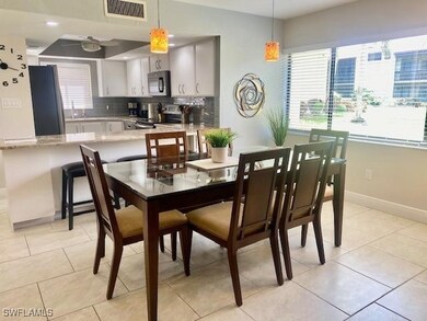 Dining space with a ceiling fan, baseboards, and l