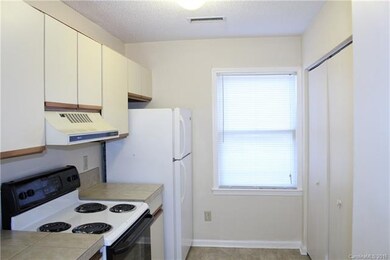 Kitchen with laundry closet with washer/dryer hook