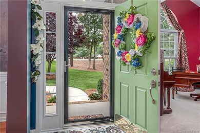 A full glass storm door lets in the morning sun.