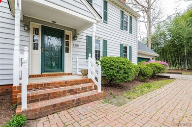 Front brick walkway to covered front porch.