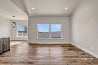 Unfurnished living room featuring light wood-style flooring, vaulted ceiling, and recessed lighting
