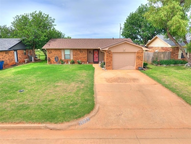 Ranch-style house with a garage, driveway, brick s