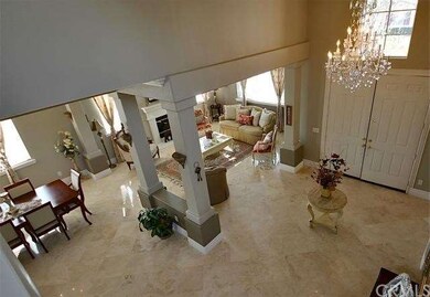 Soaring ceiling and travertine flooring