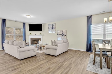 Living room with hardwood / wood-style floors and 