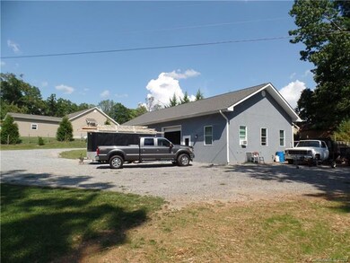 Huge high ceilings 3 car garage with a auto lift, 
