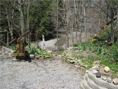 Yard/Garden A path leads down to the creekside