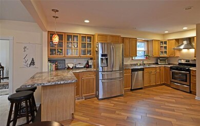 The spacious kitchen provides plentiful oak cabine