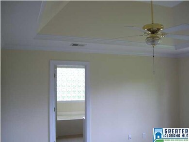 Master bedroom showing trey ceiling and entrance t