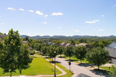 As you approach this home, you are greeted by a Covered Front Porch with views of the rolling treed hillsides in the distance.