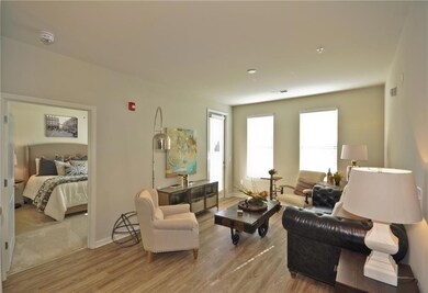 Living room with wood-type flooring