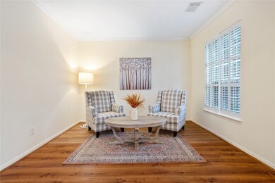 Formal living room - spacious and bright with charming plantation shutters