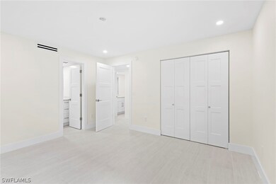 Unfurnished bedroom with a closet and ensuite bath