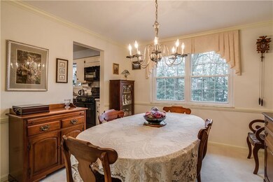 DINING ROOM IS 11X11 AND FEATURES CROWN MOLDING AN
