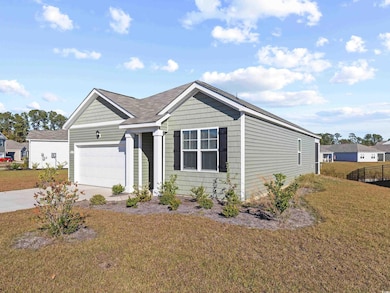View of front of home featuring a garage and a fro