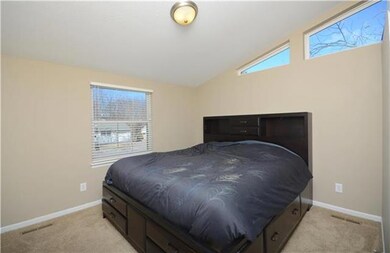 Large bedroom windows along with the angled window