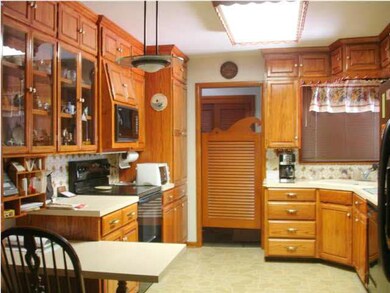 Kitchen with smooth cooktop range, microwave, dish