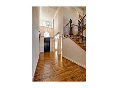 Other. Two story entry with custom wood door, scra
