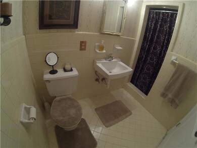 Full bath by bonus area on main level.