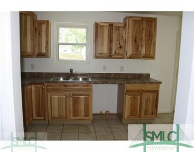 Kitchen. All new cabinets with ceramic tile floor
