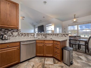 Kitchen open to breakfast nook and living room.