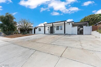 Single story home featuring driveway, a gate, fenc