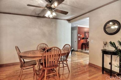 The dining area, which is just off the Living Room and adjacent to the Kitchen, is spacious enough for a large table or to use for a quick bite to eat in the morning. The dining area features a ceiling fan with a built in light fixture. It is light a