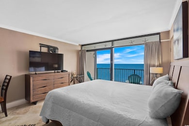 Tiled bedroom featuring ornamental molding and access to exterior