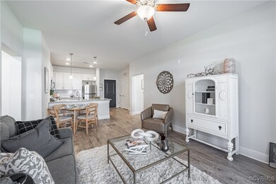 Living room with dark wood-type flooring, ceiling