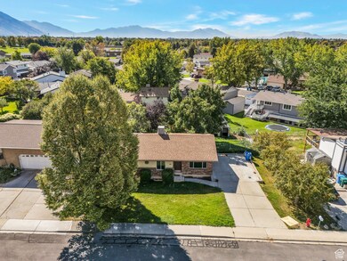 Aerial view of residential area featuring a mountainous background