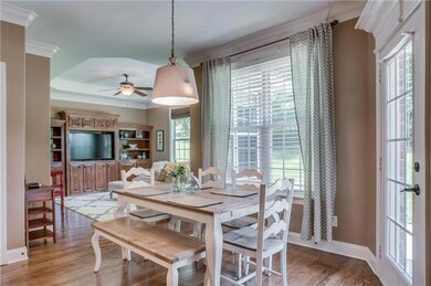 This charming breakfast nook overlooks a tucked away den/playroom perfect for reading time and tv enjoyment. Built-ins are ideal for toys, books and decorating.