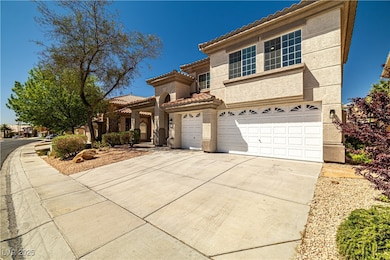 Mediterranean / spanish home featuring driveway, a
